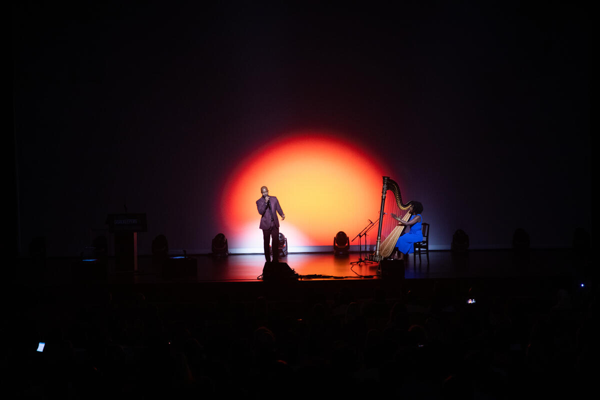 George the Poet and Brandee Younger perform onstage during Goalkeepers 2022. ©Gates Archive/Kevin Hagen