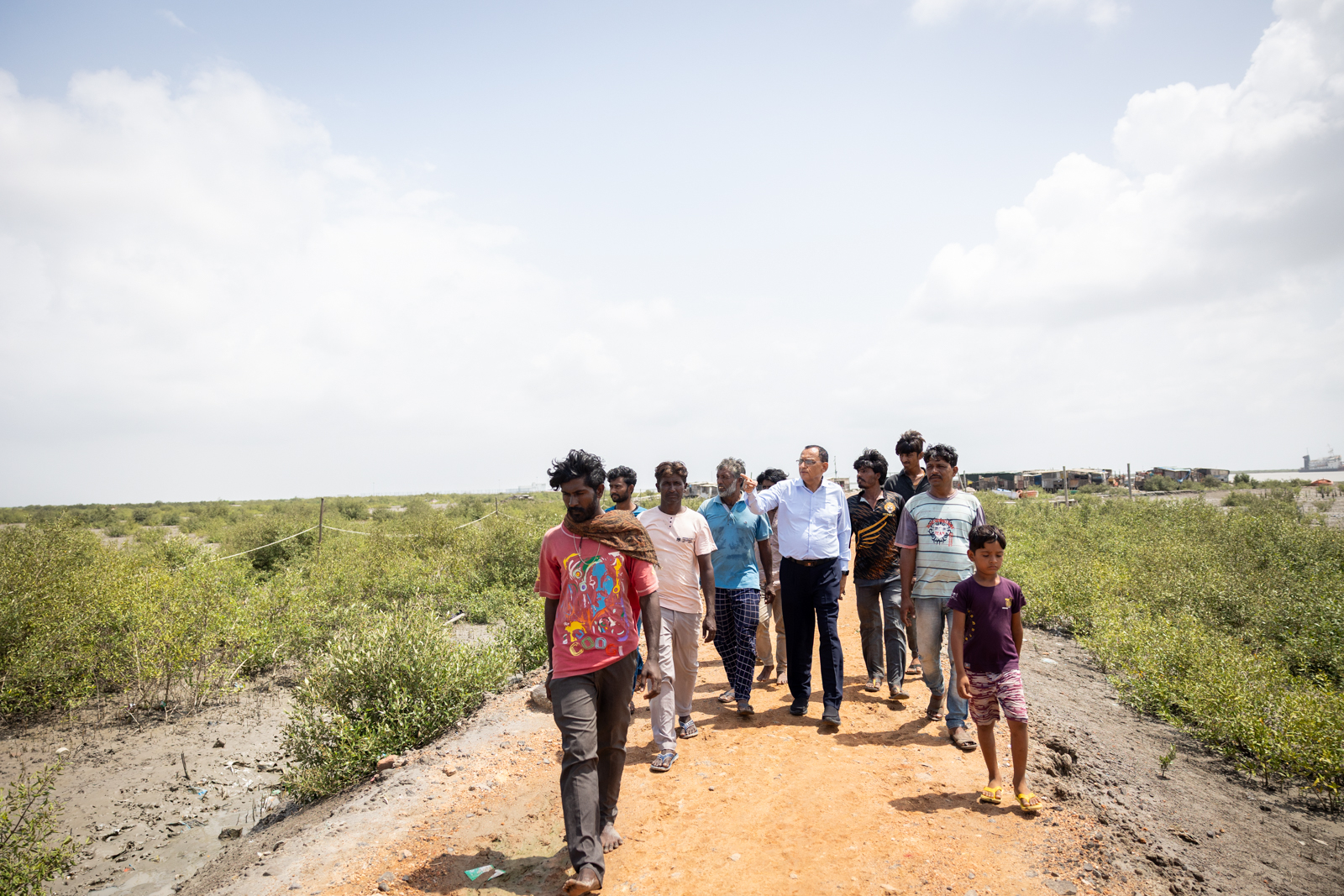 Dr. Naveen Thacker, Pediatrician, lifelong advocate against polio, and President of the International Paediatric Association, walks through a settlement in Gandhidham, Gujarat, India, on August 7, 2025.