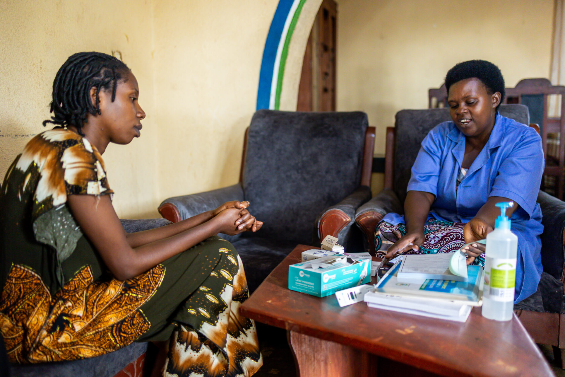 Community health worker, Gaudence Ngendahayo councils Regine Uwamahirwe in her home prior to referring her to local health facilities for antenatal care in Mwulire Sector, Rwamagana District, Eastern Province, Rwanda.