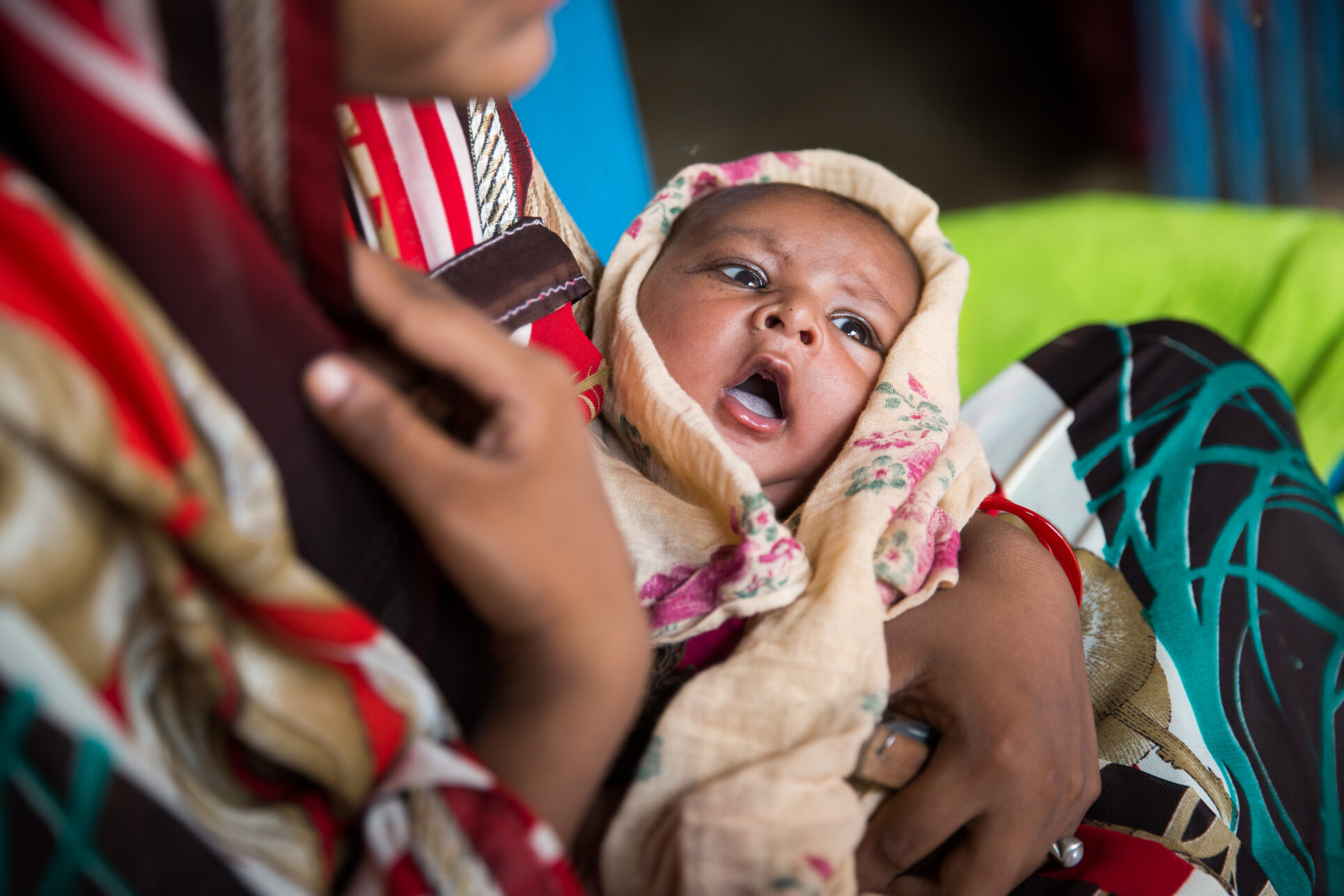 Akash, at 5-weeks old, and his mother, Saroj, in Banthar village, Unnao District, Uttar Pradesh, India.
