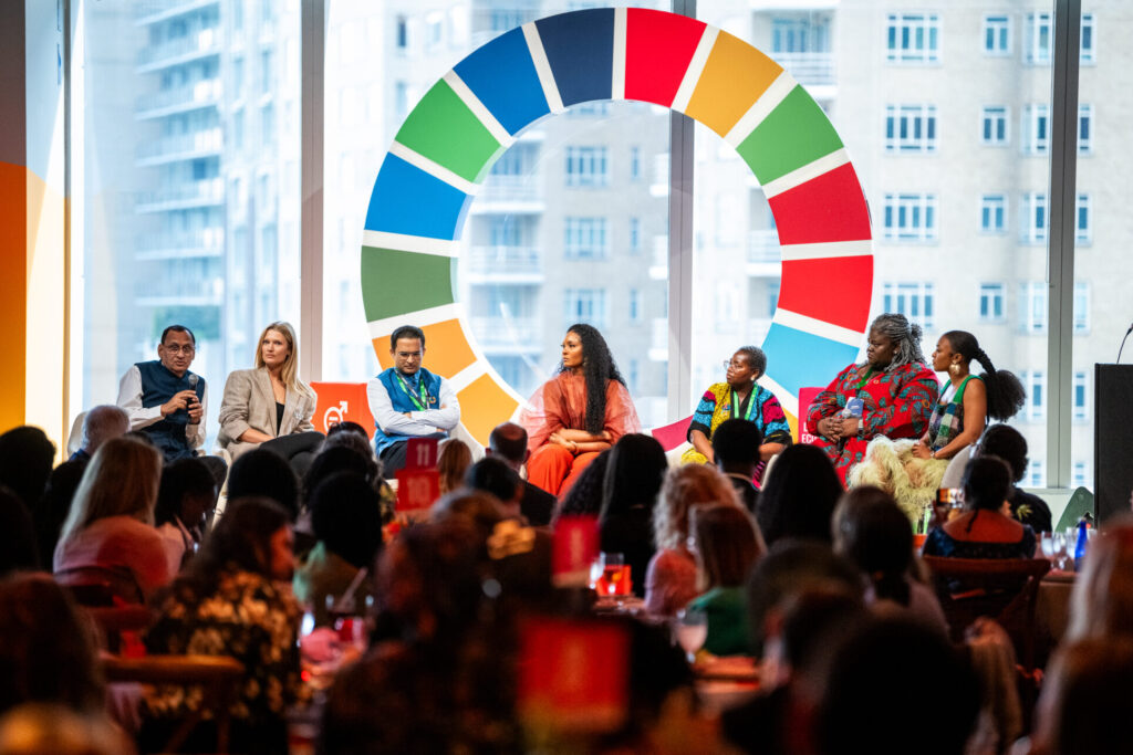 Dr. Naveen Thacker, Toni Garrn, Dr. Anand Bang, Osas Ighodaro, Jerop Limo, Krystal Birungi, and Nomzamo Mbatha speak during the Goalkeepers Champions Lunch.